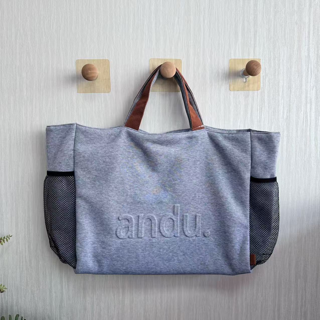 Sweater-shirt fabric tote bag with emboss logo